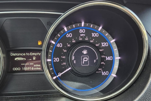 Fuel system service near me in Los Angeles and Van Nuys, CA with Sean’s Auto Care. Image of a car dashboard displaying the speedometer and an illuminated check engine light.