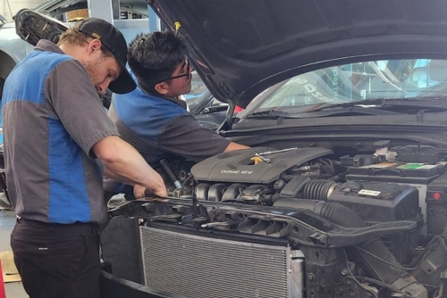 Cooling System Repair near me in Los Angeles and Van Nuys, CA with Sean’s Auto Care. Image of mechanic working on car in Van Nuys, CA for cooling system maintenance
