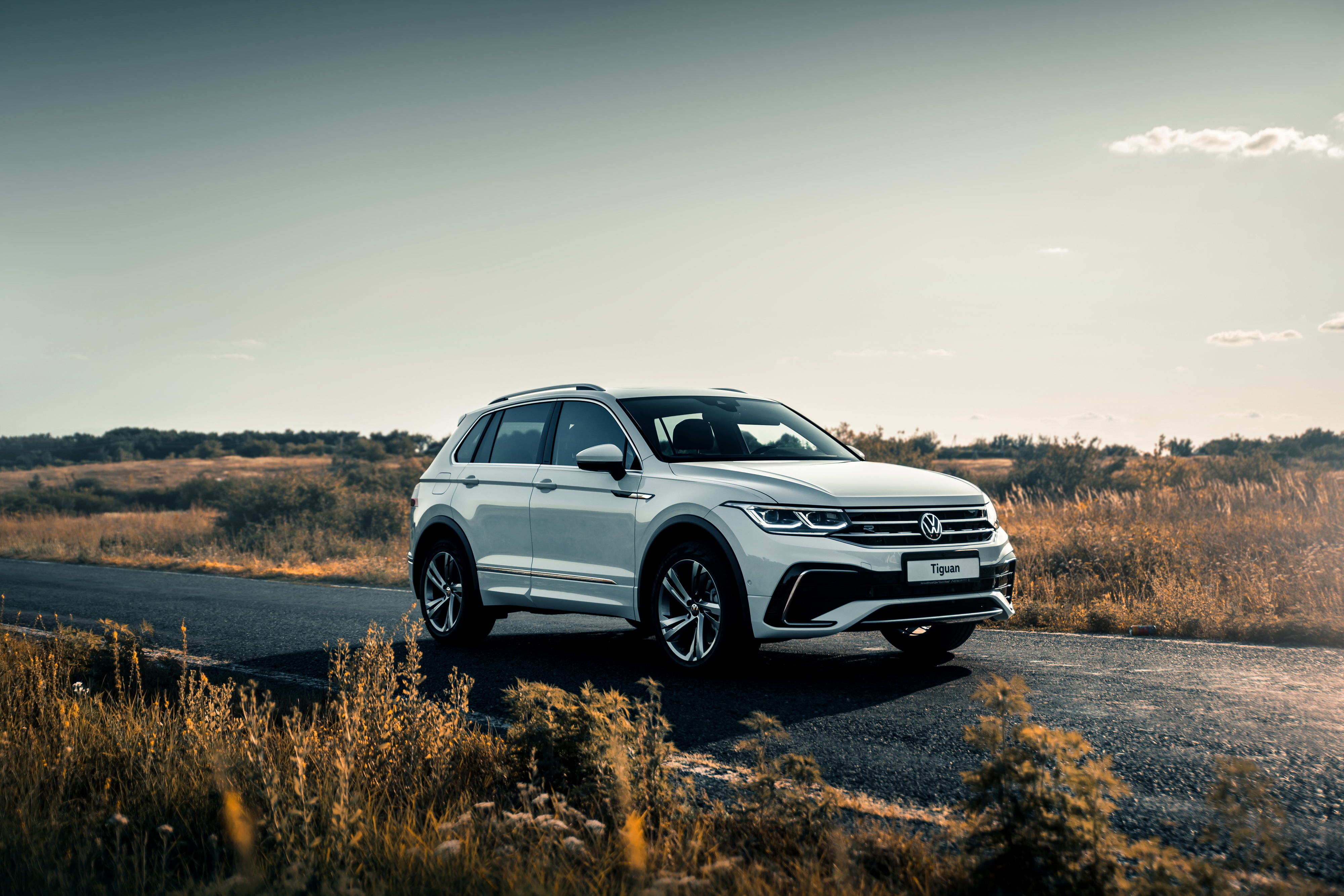 Volkswagen Repair and Maintenance in Van Nuys, CA with Sean's Auto Care. Image of white VW Tiguan driving on road trip.