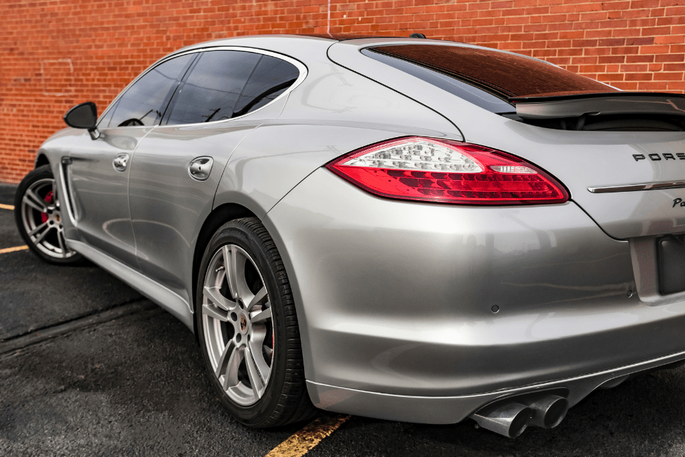 porsche repair, auto repair in Van Nuys, CA at Sean's Auto Care. A sleek silver Porsche Panamera parked in front of a brick wall.